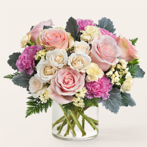 Blissful Moments Bouquet with pink roses, white roses, and purple carnations in a glass vase.
