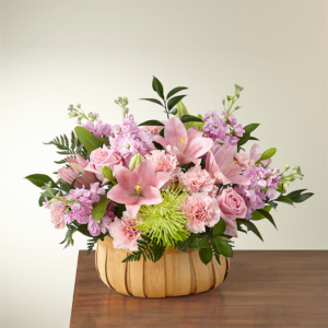 Beautiful Spirit Basket filled with pink lilies and vibrant greenery.