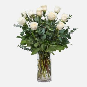 1-Dozen White Roses, arranged with eucalyptus and lush greenery in a clear glass vase