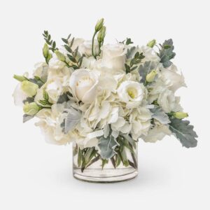 Alabaster Whisper Bouquet, Classic white rose and hydrangea floral arrangement in a glass vase.