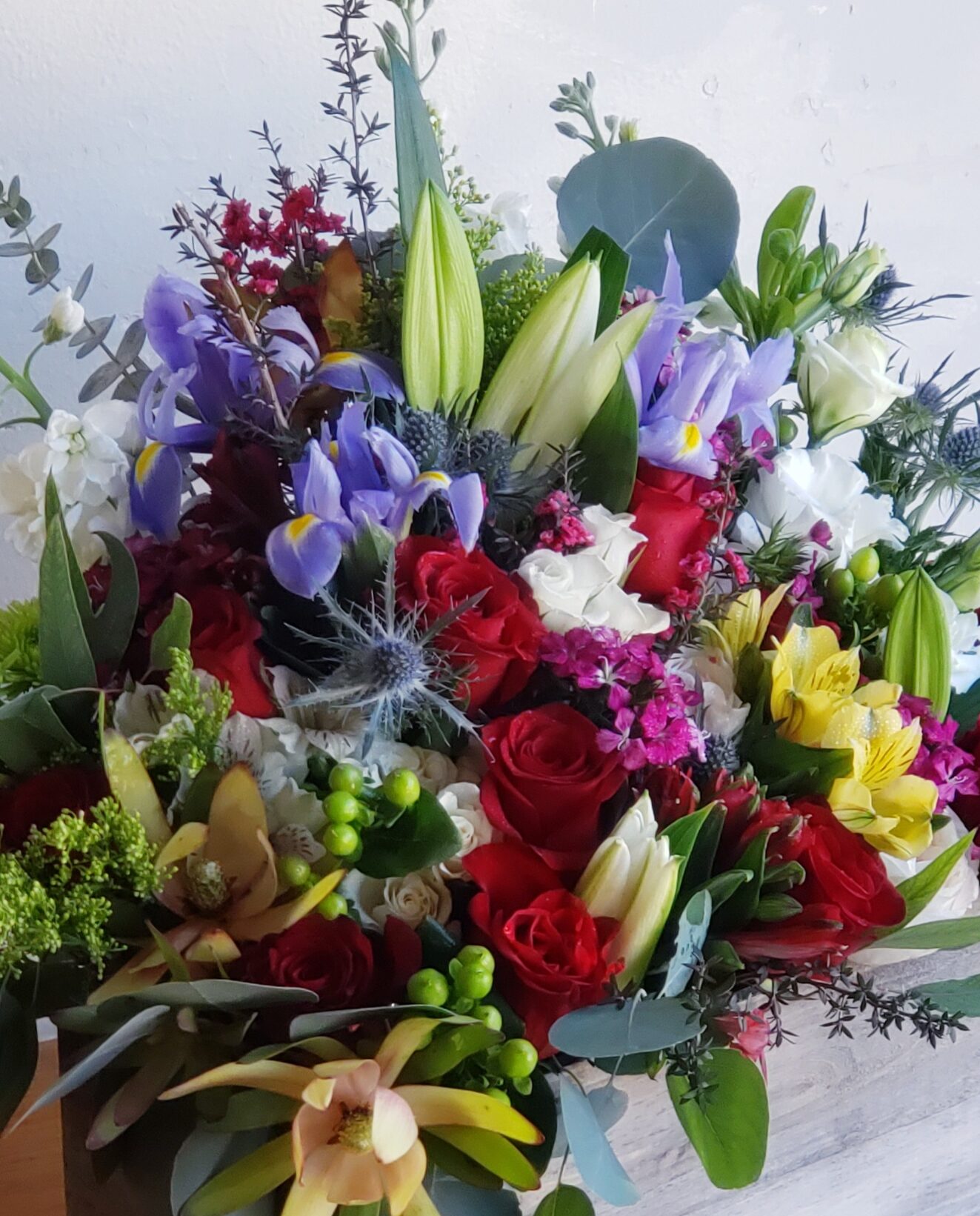 Colorful floral arrangement in wooden box by lake forest florist marketplace