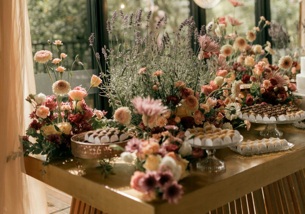 A beautifully decorated table with vibrant floral arrangements perfect for weddings or special occasions.