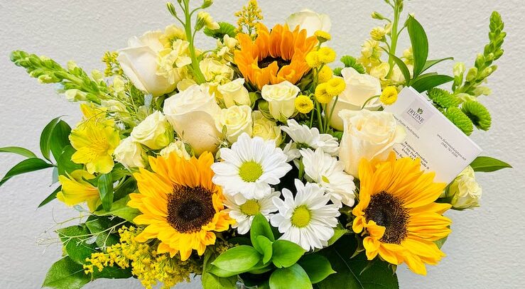 Colorful bouquet with sunflowers and roses