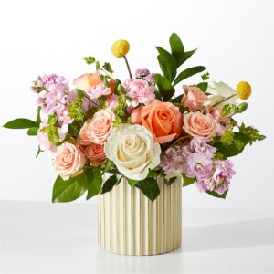 Colorful floral arrangement in vase.