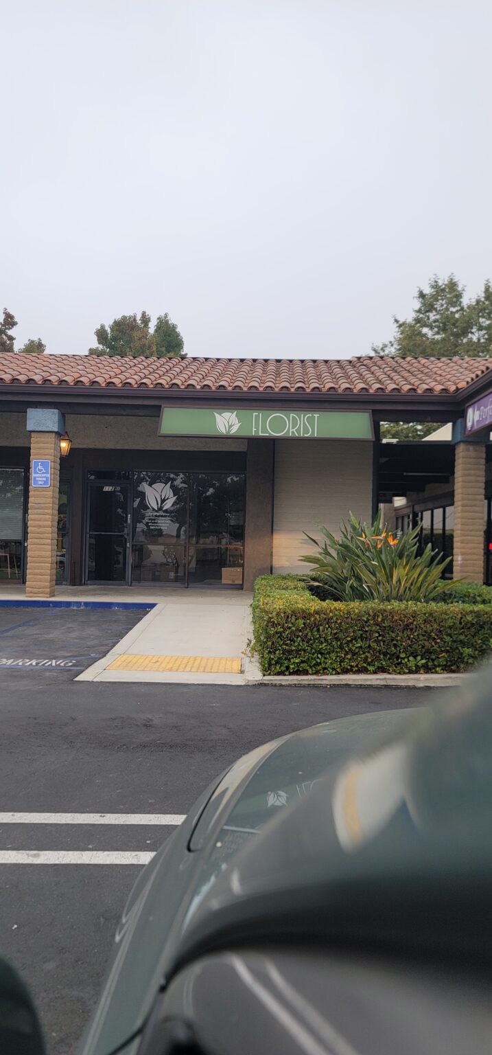 Florist shop with outdoor greenery.